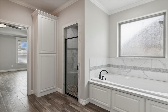 bathroom featuring independent shower and bath, ceiling fan, wood-type flooring, and ornamental molding