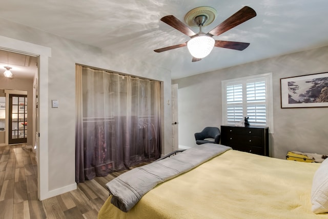 bedroom featuring hardwood / wood-style flooring and ceiling fan