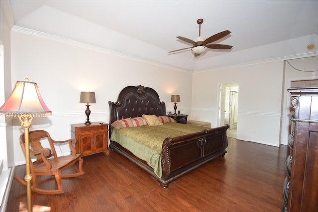 bedroom with ensuite bath, ceiling fan, dark wood-type flooring, and ornamental molding