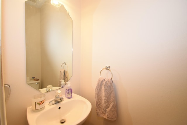 bathroom featuring toilet and sink