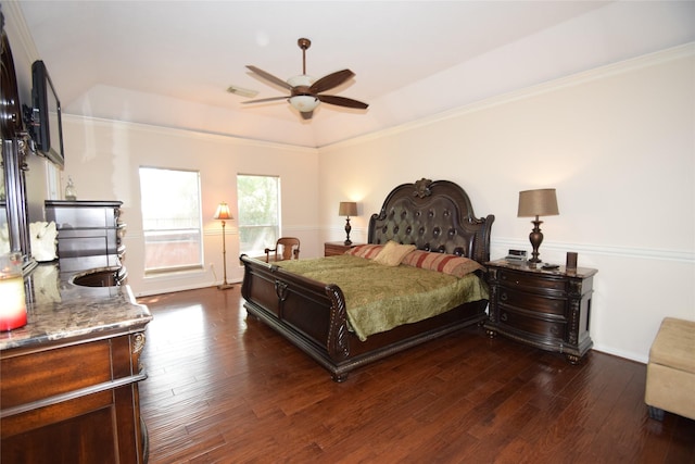 bedroom featuring ceiling fan, dark hardwood / wood-style flooring, and ornamental molding