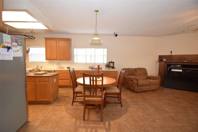 dining area featuring light tile patterned floors