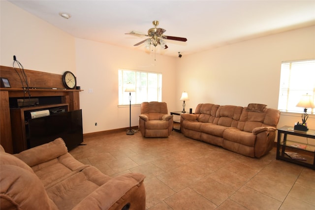 living room featuring ceiling fan and light tile patterned floors