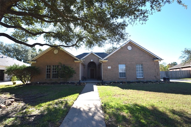 ranch-style home with a front yard