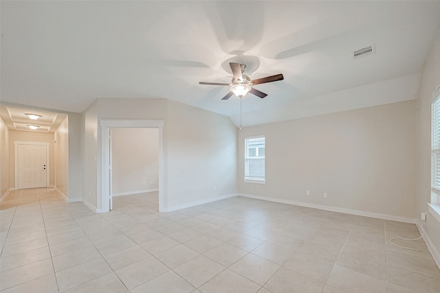 tiled empty room with ceiling fan