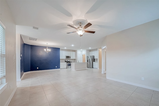 unfurnished living room featuring light tile patterned floors and ceiling fan with notable chandelier