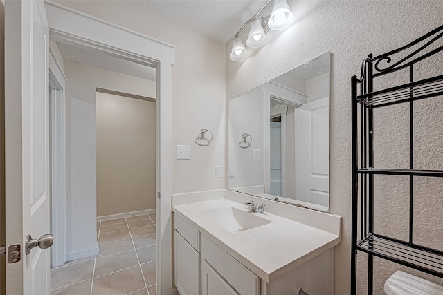 bathroom with tile patterned flooring and vanity