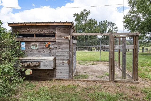 view of outbuilding with a lawn