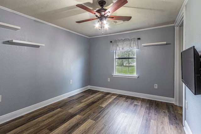 unfurnished room featuring crown molding, dark wood-type flooring, and ceiling fan