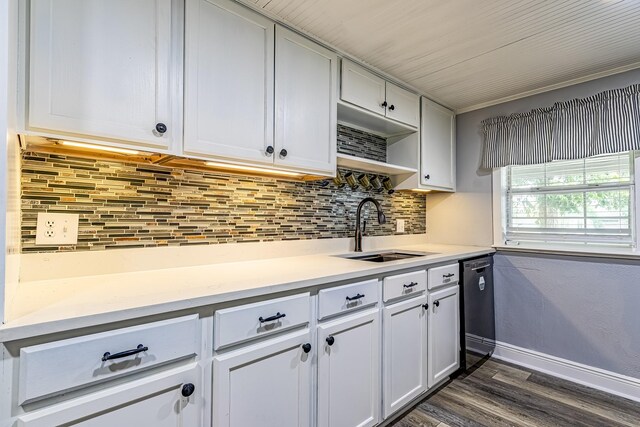 kitchen with dark hardwood / wood-style flooring, black dishwasher, sink, decorative backsplash, and white cabinetry