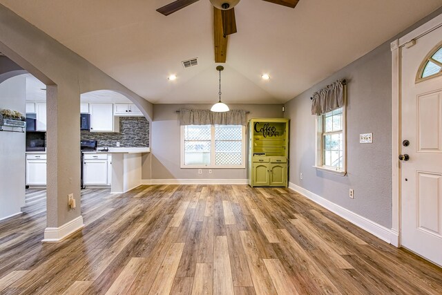 interior space featuring ceiling fan, a wealth of natural light, and light hardwood / wood-style flooring