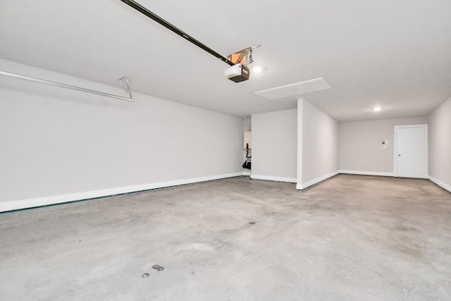 garage featuring baseboards and a garage door opener