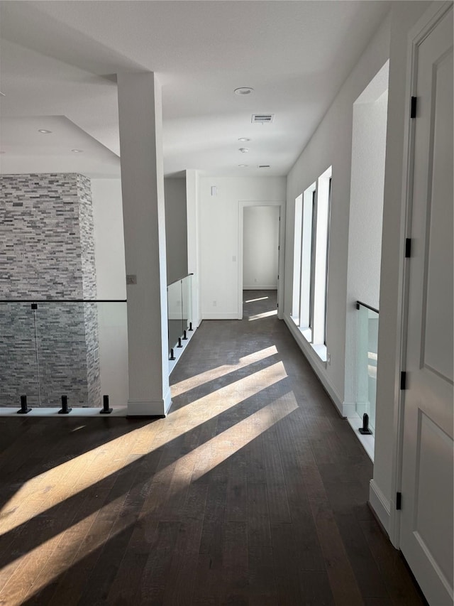 hall with dark wood-type flooring