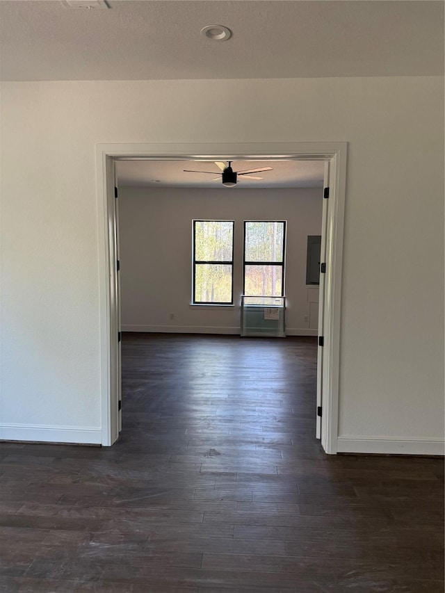 spare room with dark hardwood / wood-style flooring