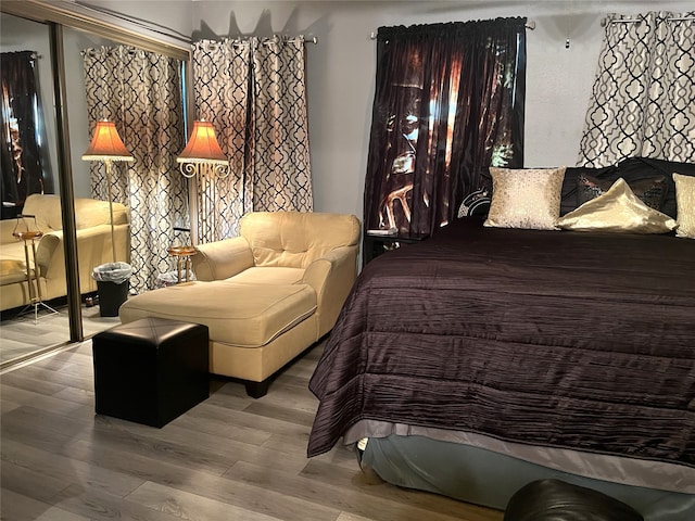 bedroom with wood-type flooring