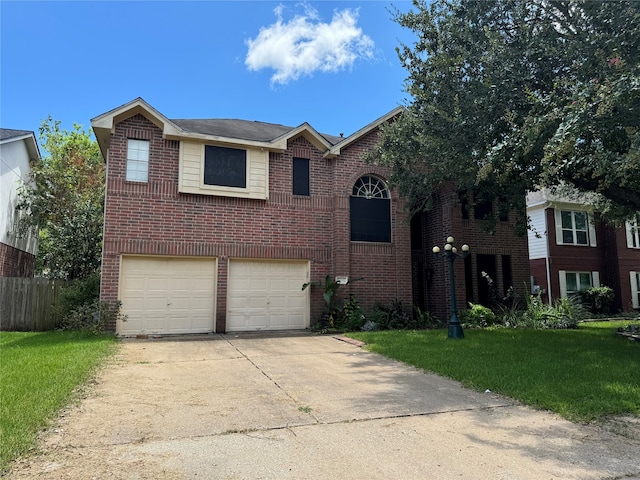 view of front of property with a front yard and a garage