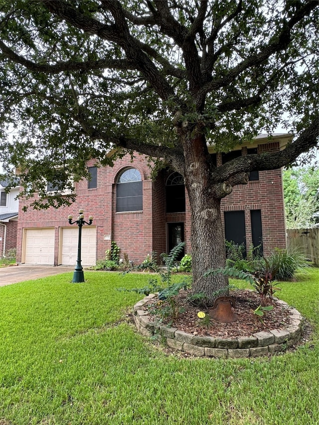 view of front of property with a garage and a front yard