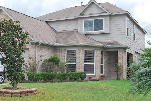 view of front facade with a front lawn