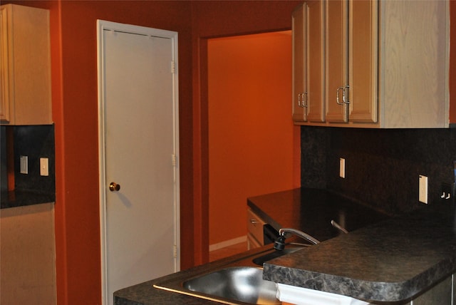 kitchen with sink and backsplash