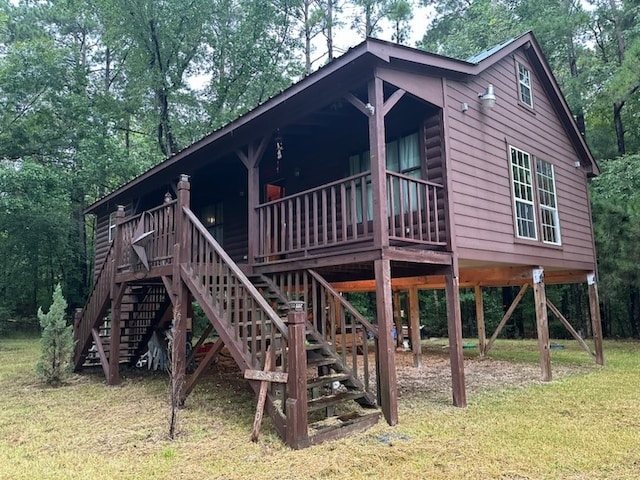 view of playground with a yard and a wooden deck