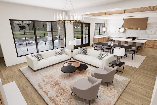 living room featuring light wood-type flooring and a chandelier