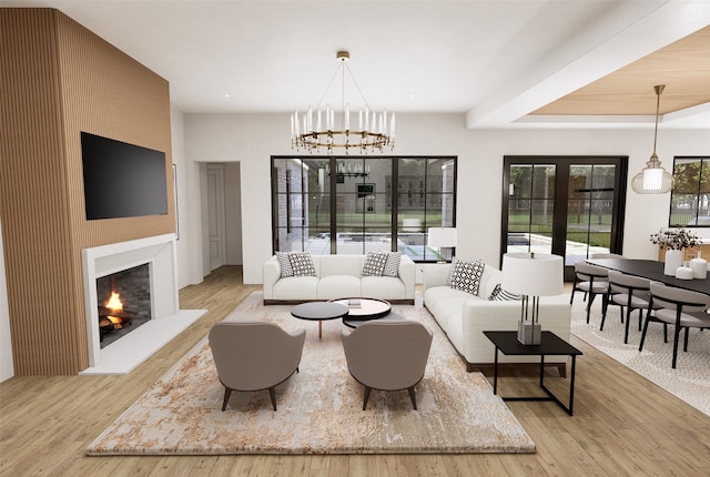 living room with light wood-type flooring and an inviting chandelier