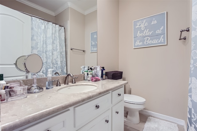 bathroom with crown molding, vanity, toilet, and tile patterned flooring