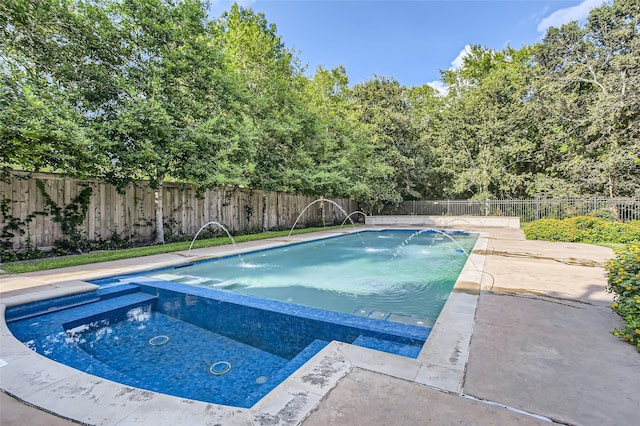 25002 Falling Water Estates Ln, Katy, TX 77494 - view of pool with a pool with connected hot tub, a fenced backyard, and a patio area
