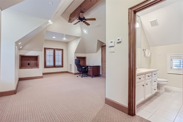 interior space with light tile patterned floors, high vaulted ceiling, sink, and ceiling fan