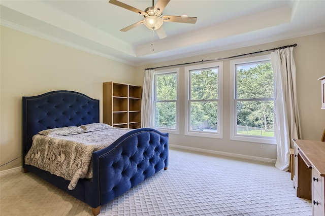 25002 Falling Water Estates Ln, Katy, TX 77494 - bedroom with a tray ceiling, multiple windows, baseboards, and crown molding
