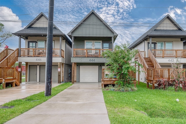 view of front of property with a garage and a front lawn