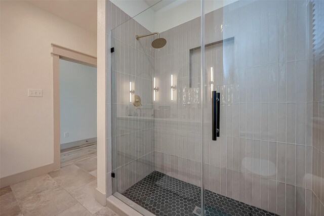 bathroom with a shower with shower door