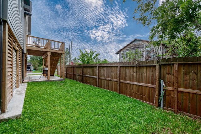 view of yard with a patio area and a deck