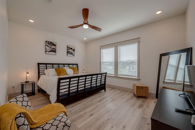 bedroom featuring ceiling fan and hardwood / wood-style floors