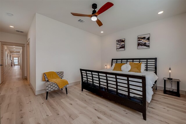 bedroom with ceiling fan and light wood-type flooring