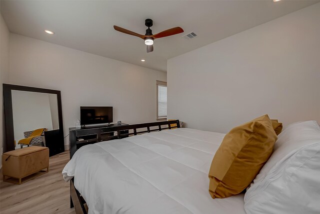 bedroom featuring light hardwood / wood-style flooring and ceiling fan