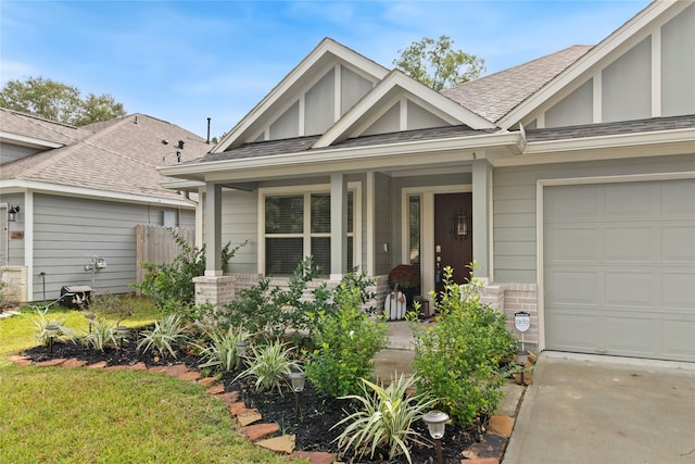 view of front of home with a garage and a porch