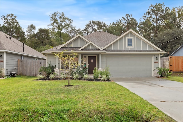 view of front facade featuring a garage and a front lawn