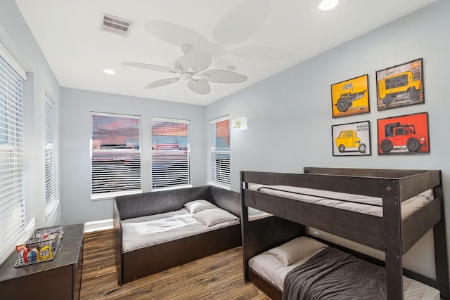 bedroom with ceiling fan and hardwood / wood-style floors