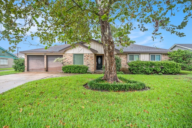 single story home featuring a garage and a front yard