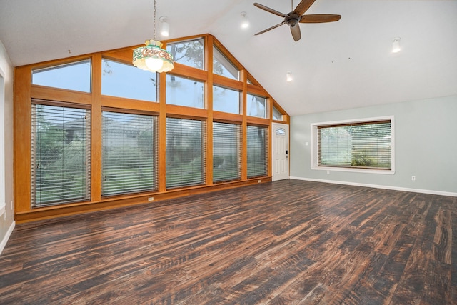 unfurnished living room with high vaulted ceiling, ceiling fan, and dark hardwood / wood-style floors