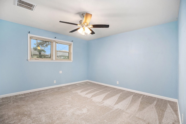 spare room with carpet flooring and ceiling fan