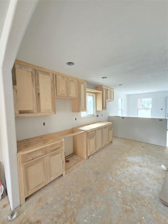 kitchen featuring light brown cabinets