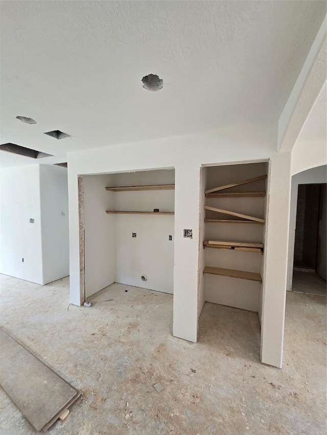 interior space featuring a textured ceiling