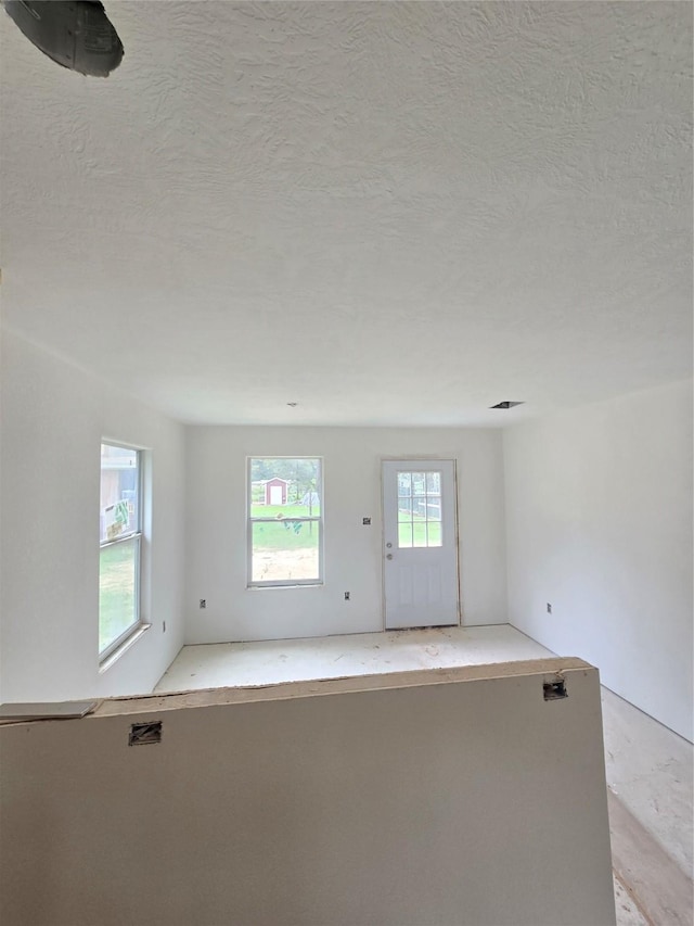 empty room with a textured ceiling