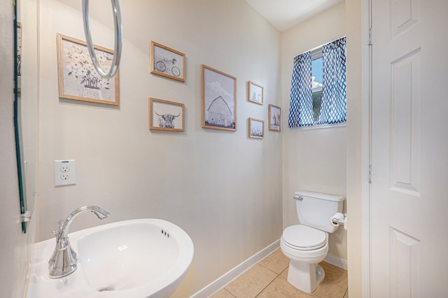 bathroom with tile patterned floors, toilet, and sink