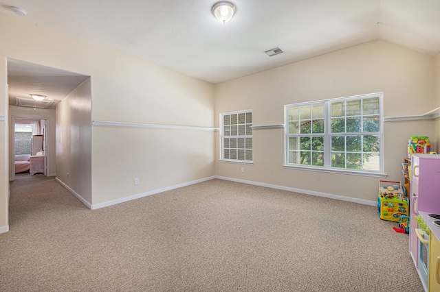 interior space featuring lofted ceiling and carpet