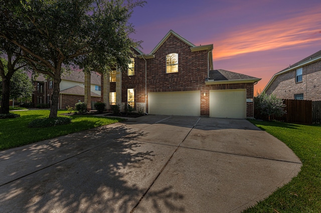 view of front facade featuring a yard and a garage