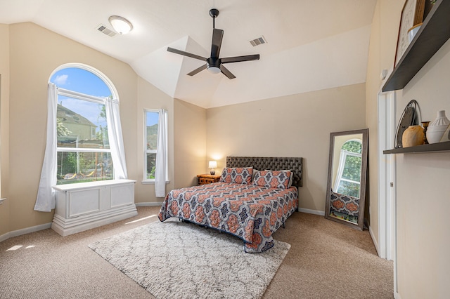 bedroom featuring vaulted ceiling, light colored carpet, and ceiling fan