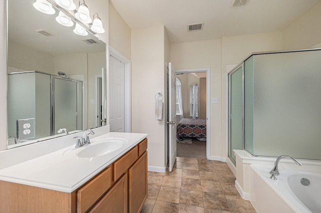 bathroom featuring independent shower and bath and vanity